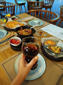 Lunch at a cafe. View of the table with food and drink in hand. Pilaf. Uzbek cuisine.