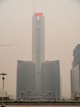 Skyscrapers of Hong Kong. The cityscape through a haze of smog over the city.