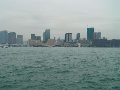 Skyscrapers of Hong Kong. The cityscape through a haze of smog over the city.