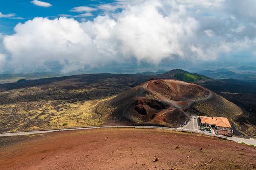 View of Etna volcano craters among the clouds near Rifugio Sapienza. Sicily, Italy