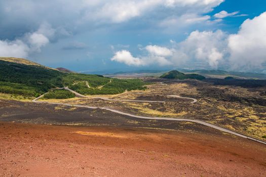 View of Etna volcano craters among the clouds near Rifugio Sapienza. Sicily, Italy