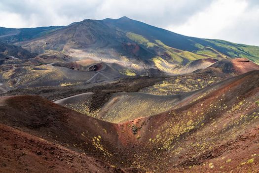 View of Etna volcano craters among the clouds near Rifugio Sapienza. Sicily, Italy