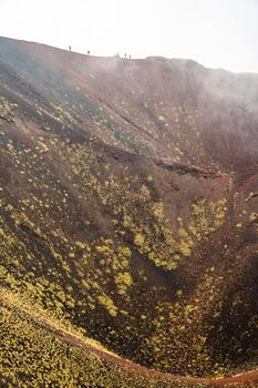 View of Etna volcano craters among the clouds near Rifugio Sapienza. Sicily, Italy