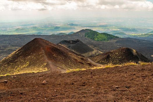 View of Etna volcano craters among the clouds near Rifugio Sapienza. Sicily, Italy