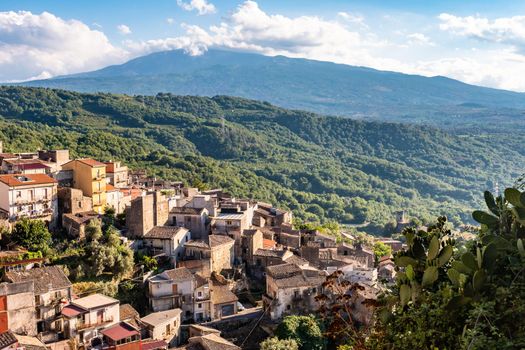 Panoramic view of Castiglione di Sicilia with mount Etna in the background, Italy