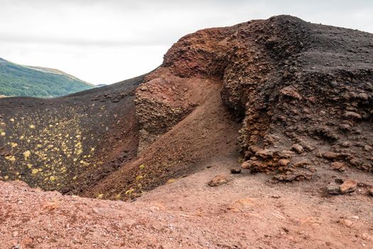 View of Etna volcano craters among the clouds near Rifugio Sapienza. Sicily, Italy