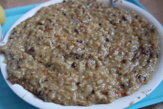 A close up view of Cooked white rice called Kichra served with green mint with traditional Charsadda recipe popular for its delicious taste in Pakistan