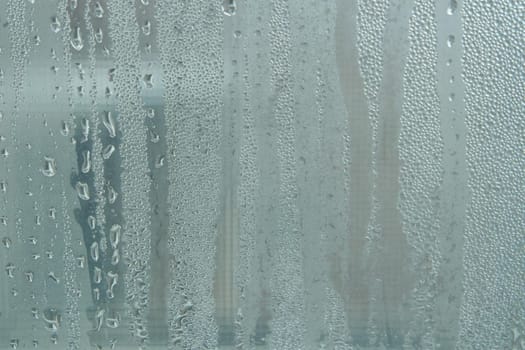 Bright grey color glassy texture, with water drops on it. Water drop glassy background