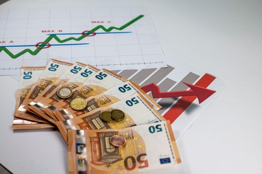 50 euro banknotes coins and statistics on white background