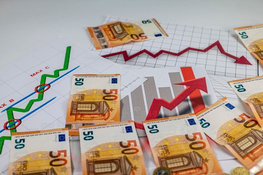 50 euro banknotes coins and statistics on white background