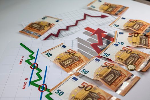 50 euro banknotes coins and statistics on white background