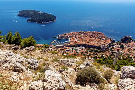 Croatia. South Dalmatia. Aerial view of Dubrovnik, a medieval old town surrounded by a defensive wall. The island of Lokrum is visible in the distance.
