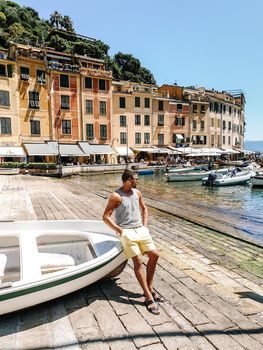 Portofino Liguria Italy, Beautiful bay with colorful houses in Portofino, Liguria, Italy.Europe, young men on vacation Italy Portofino