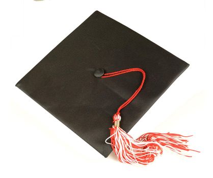 An overhead shot of an isolated over white grad hat mortarboard for educational ceremonies.