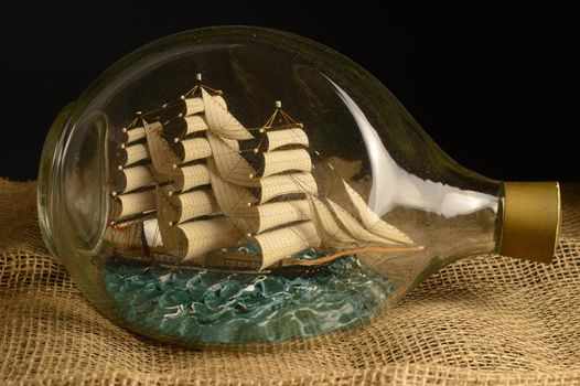 A traditional ship in a bottle crafted to showcase its appealing beauty.