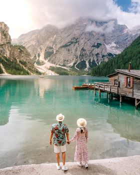 Beautiful lake in the Italian alps, Lago di Braies, a couple on vacation in the Italian Alps Italy Dolomites prages wildsee