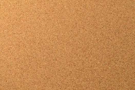 A full frame image of a clean corkboard to use as a background element.
