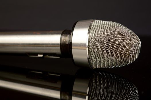 A closeup of a mic drop after hitting the floor.