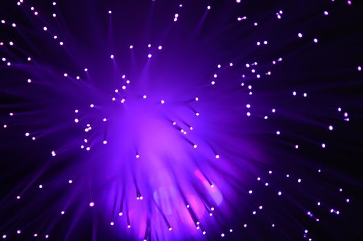 A purple abstract background from a series of color changing images of the same scene of fiber optic cables.
