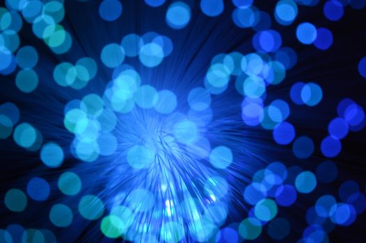 A blue abstract background from a series of color changing images of the same scene of fiber optic cables.