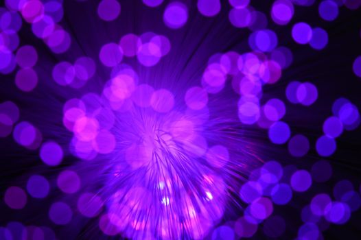 A purple abstract background from a series of color changing images of the same scene of fiber optic cables.