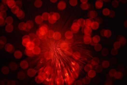 A red abstract background from a series of color changing images of the same scene of fiber optic cables.