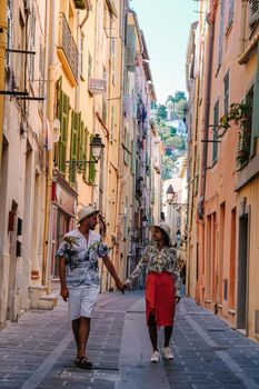 Menton France colorful town French Rivera, colorful old town Menton on french Riviera, France. Europe, couple men and woman on vacation in Menton