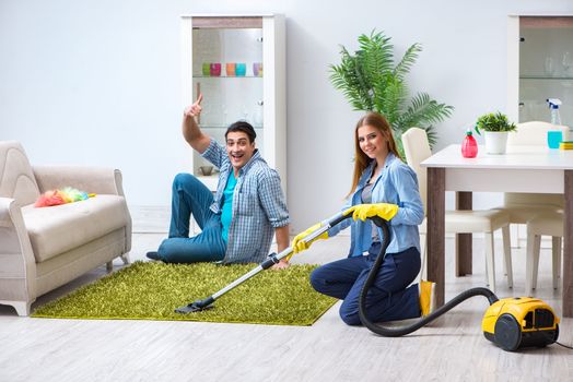 Young family cleaning the house