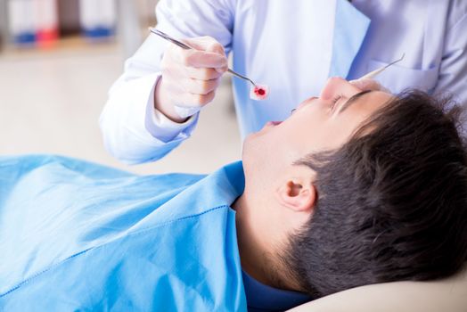 Patient visiting dentist for regular check-up and filling