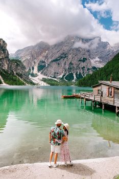 Beautiful lake in the Italian alps, Lago di Braies, a couple on vacation in the Italian Alps Italy Dolomites prages wildsee