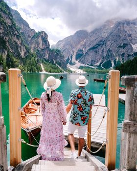 Beautiful lake in the Italian alps, Lago di Braies, a couple on vacation in the Italian Alps Italy Dolomites prages wildsee