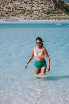 Balos Beach Crete Greece, Balos beach is on of the most beautiful beaches in Greece at the Greek Island, woman in a swimsuit on the beach