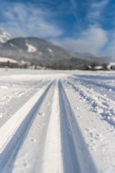 Cross-country skiing slope in Austria, beautiful mountain scenery, blurry background