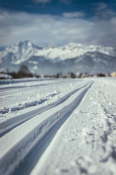 Cross-country skiing slope in Austria, beautiful mountain scenery, blurry background