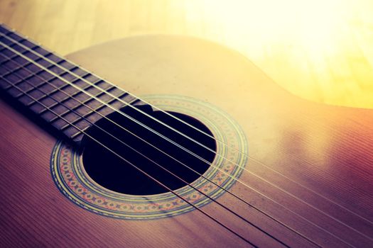 Cutout of a classical guitar corpus and strings, closeup