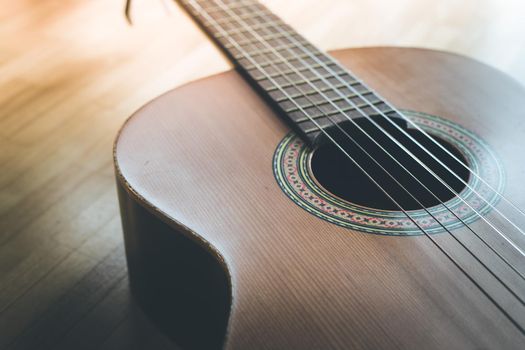 Cutout of a classical guitar corpus and strings, closeup