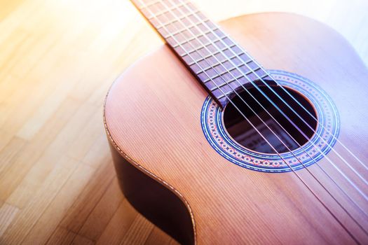 Cutout of a classical guitar corpus and strings, closeup