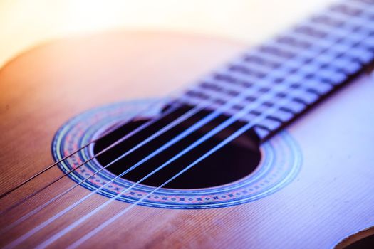 Cutout of a classical guitar corpus and strings, closeup