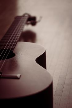 Cutout of a classical guitar corpus and strings, closeup