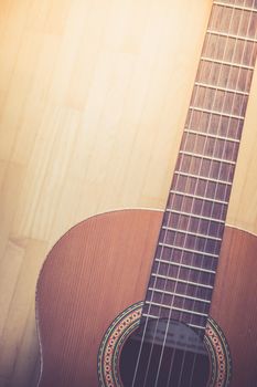 Cutout of a classical guitar corpus and strings, closeup