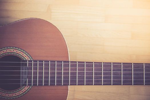 Cutout of a classical guitar corpus and strings, closeup