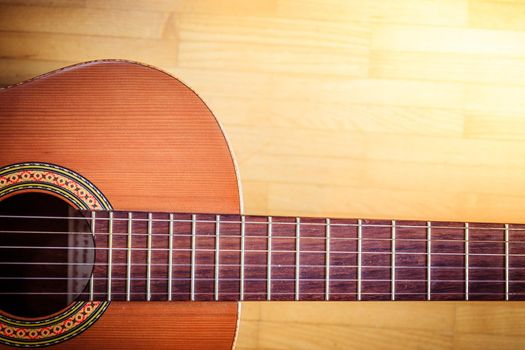 Cutout of a classical guitar corpus and strings, closeup