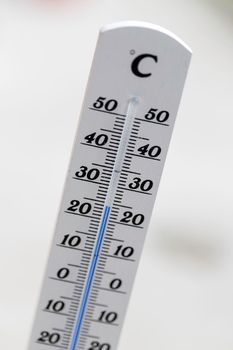 Thermometer close up picture in summer time, blurry background