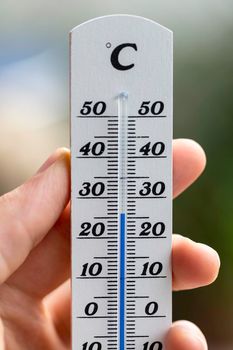 Thermometer close up picture in summer time, blurry background