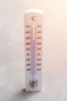 Thermometer close up picture in summer time, concrete floor