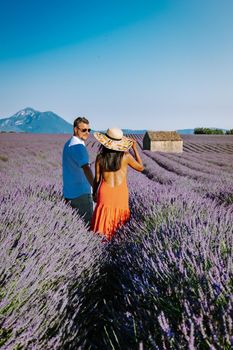 Provence, Lavender field France, Valensole Plateau, colorful field of Lavender Valensole Plateau, Provence, Southern France. Lavender field. Europe. Couple men and woman on vacation at the provence lavender fields,