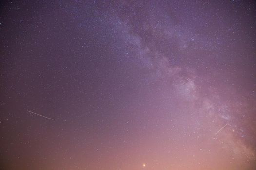 Clear purple sky with stars, colorful night scape