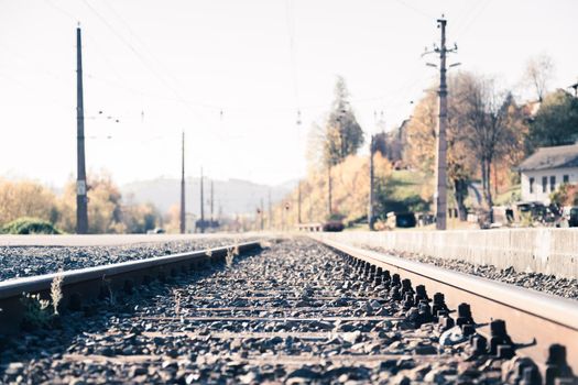 Landscape of an old abandoned railway in fall. Warm light, sustainable traveling