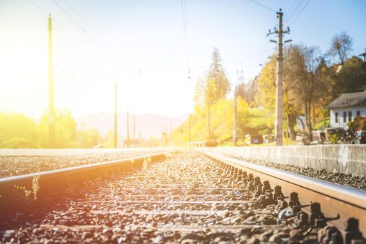 Landscape of an old abandoned railway in fall. Warm light, sustainable traveling