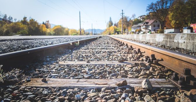 Landscape of an old abandoned railway in fall. Warm light, sustainable traveling